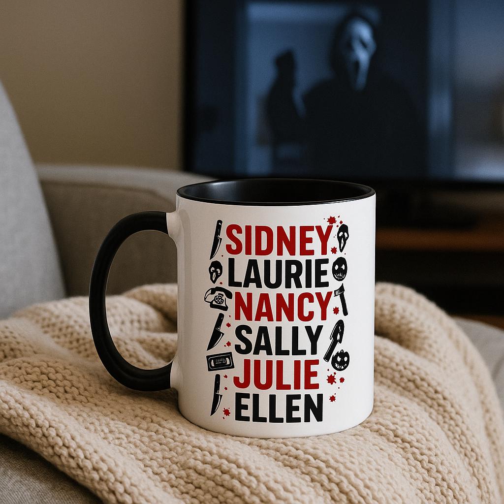 Final Girls horror mug with black interior placed on cozy knitted blanket with TV showing a horror film in background, perfect for Halloween movie marathons.